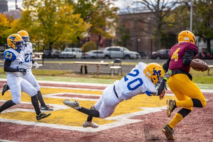 Singleback Formation receiver goes for a touchdown during a football game